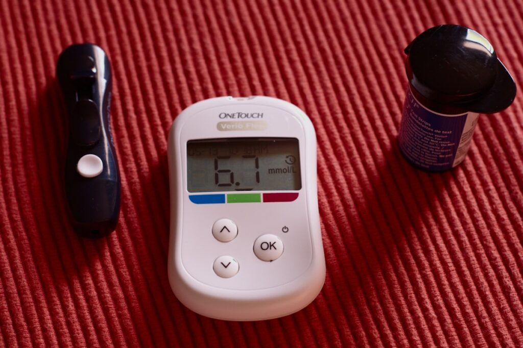 Blood glucose meter measuring blood sugar level